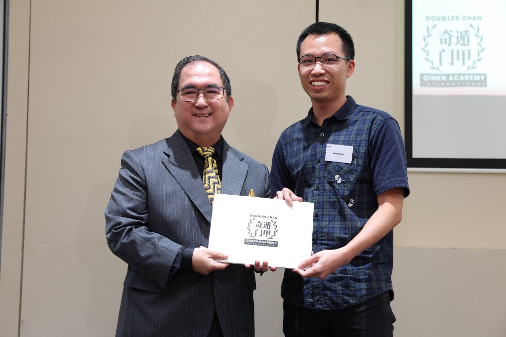 Dougles Chan presenting a Qi Men Dun Jia graduation certificate