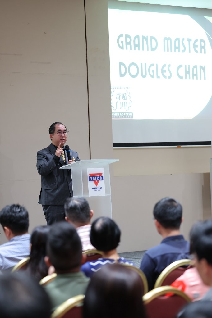 Dougles Chan speaking at a Qi Men Dun Jia graduation ceremony