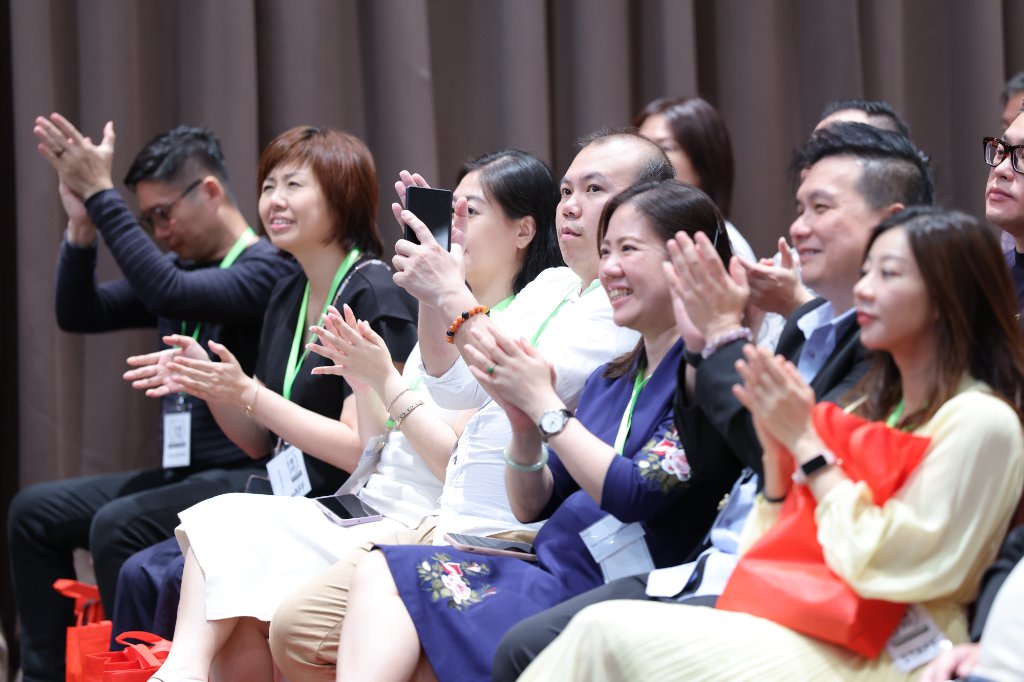 Students applauding at the Qi Men Dun Jia graduation ceremony